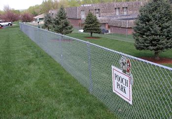 a fence with ahoch park sign on it